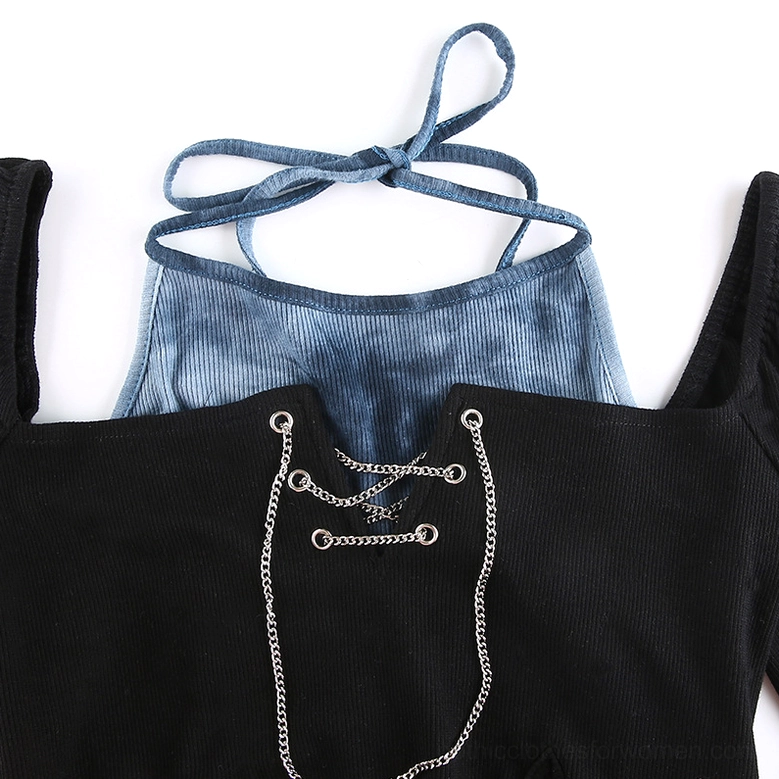 Close-up detail of metal chain lace-up accents on tie-dye ribbed fabric, showing craftsmanship and industrial gothic elements