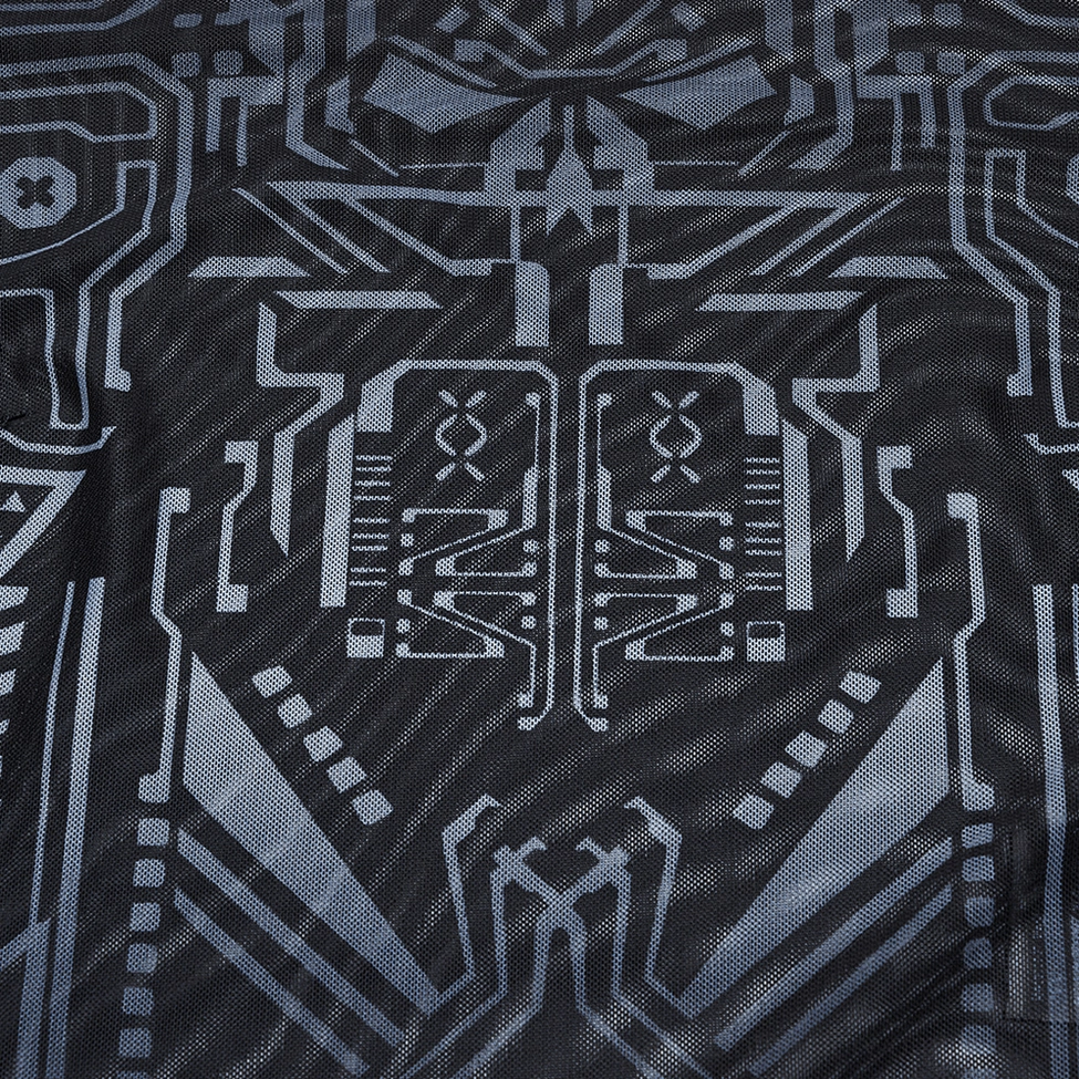 Close-up macro view of grey circuit skull motif and black mesh fabric texture