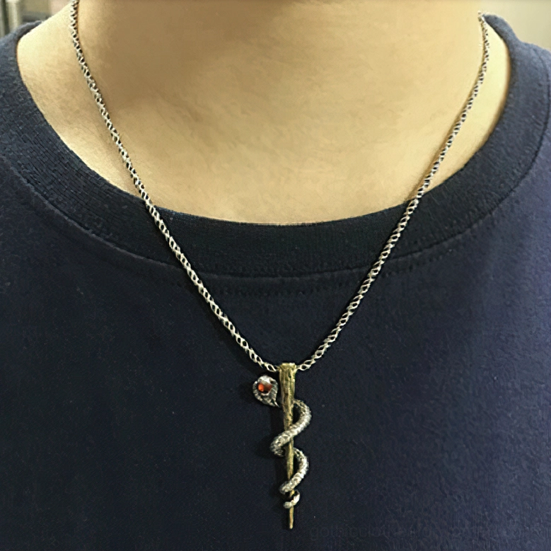 Cobra pendant necklace with red gemstone worn on chest showing gothic everyday wear styling