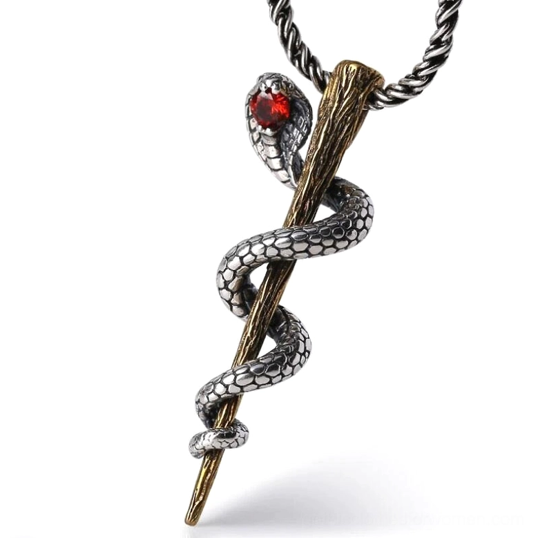 Cobra sterling silver pendant with red gemstone, detailed scaled snake design on white background