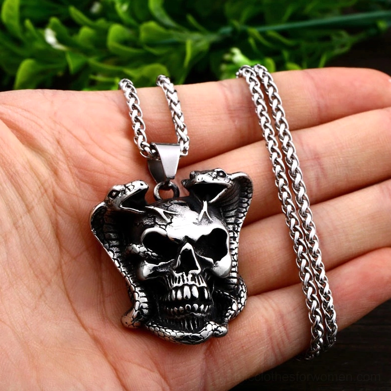 Cobra skull gothic necklace styled - alternative fashion jewelry in dark aesthetic setting
