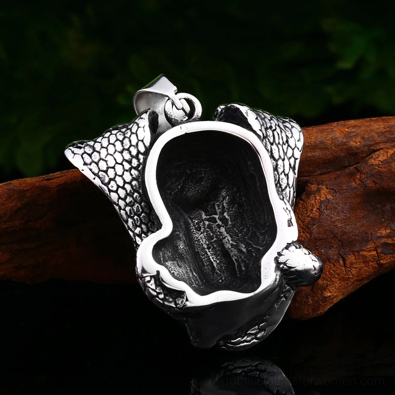 Cobra skull pendant reverse detail - back view close-up showing scale texture and metal craftsmanship