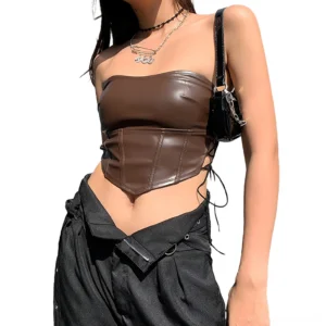Coffee brown faux leather crop corset with asymmetrical hem and side lace-up design, front half-body shot on model outdoors