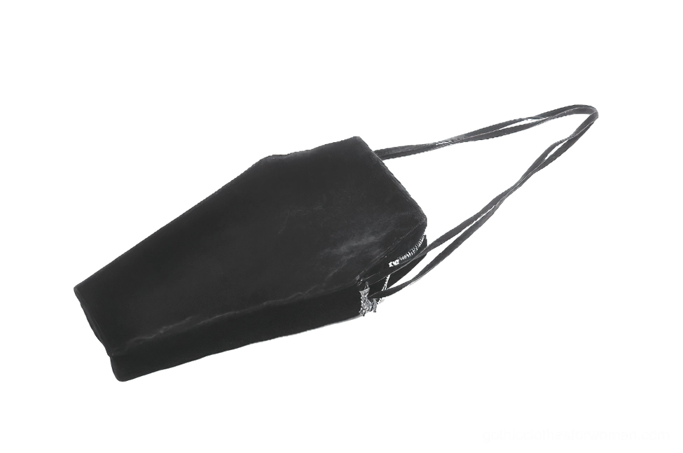 Coffin shoulder bag rear oblique view demonstrating slim profile solid black back and secure zipper closure