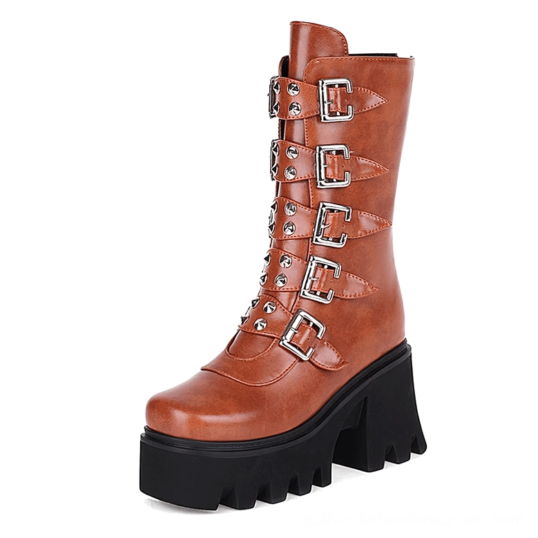 Cognac brown platform combat boots featuring silver buckles studs and industrial lug platform sole