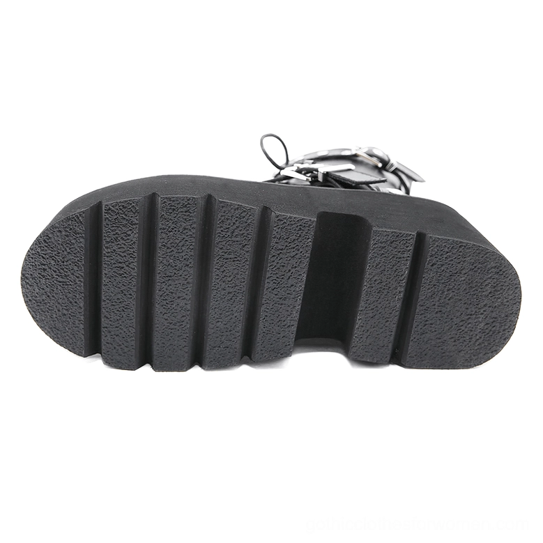 Black combat boots lugged rubber tread anti-slip outsole, bottom flat view