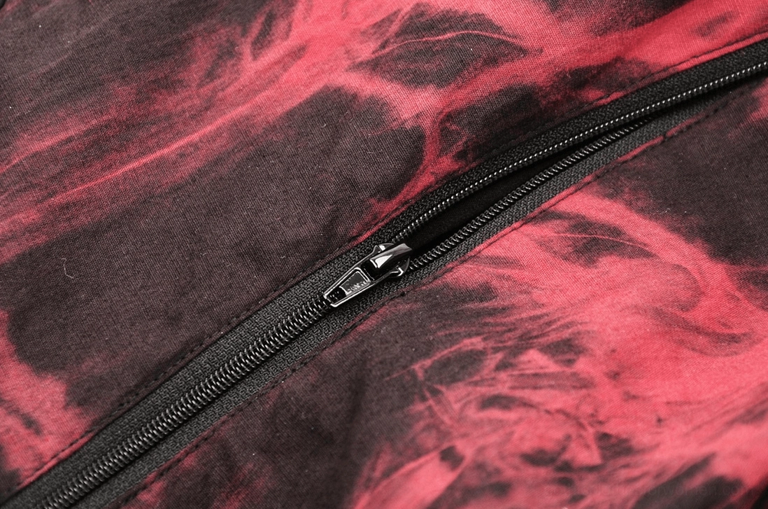 Alternative angle of red and black tie-dye corset highlighting batwing hem construction and side panel details