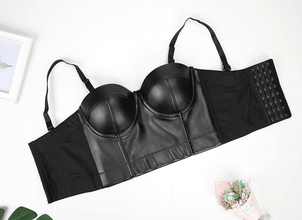 Black PU leather corset bra top-down flat lay view showing adjustable shoulder straps and hook-and-eye back closure