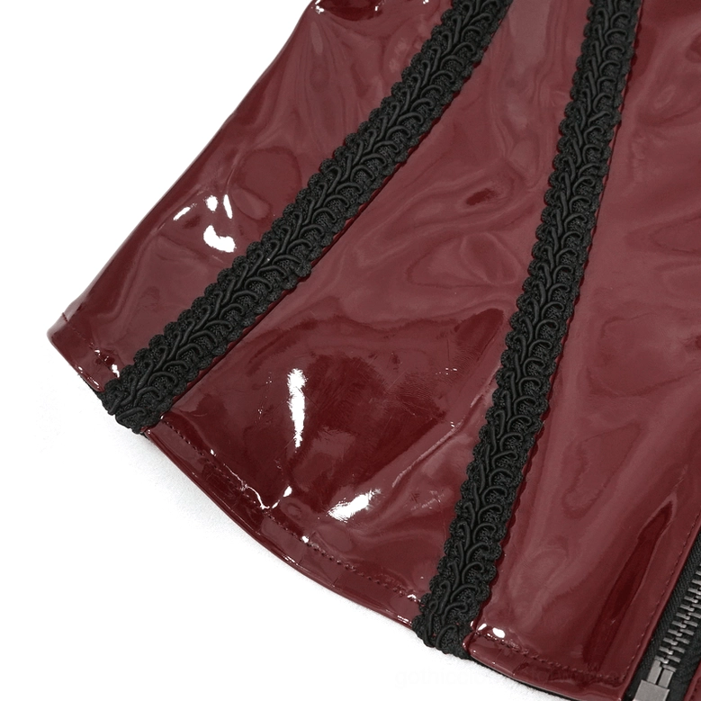 Close-up detail of black embroidered floral lace trim on wine red PU corset
