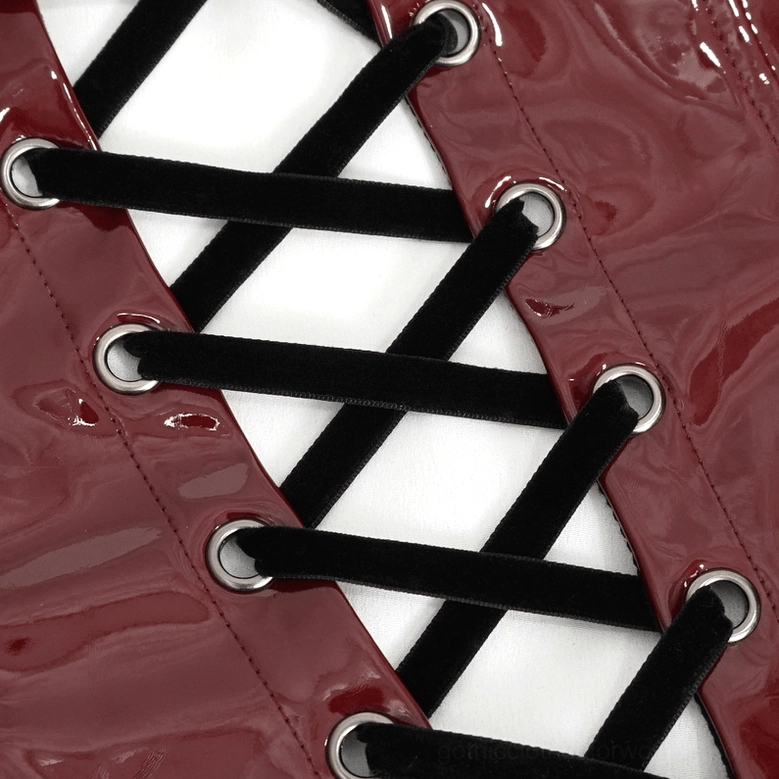 Lace-up corset back closure detail with black ribbon lacing and metal eyelet fasteners