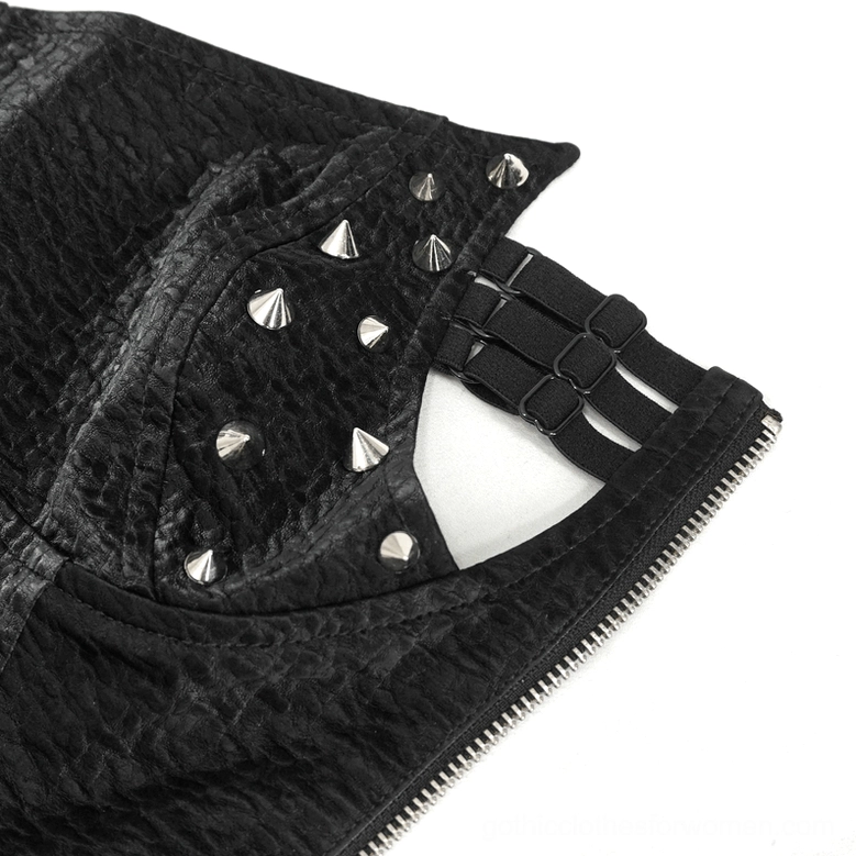 Close-up of pyramid metal rivets and adjustable buckle straps on shoulder of gothic corset
