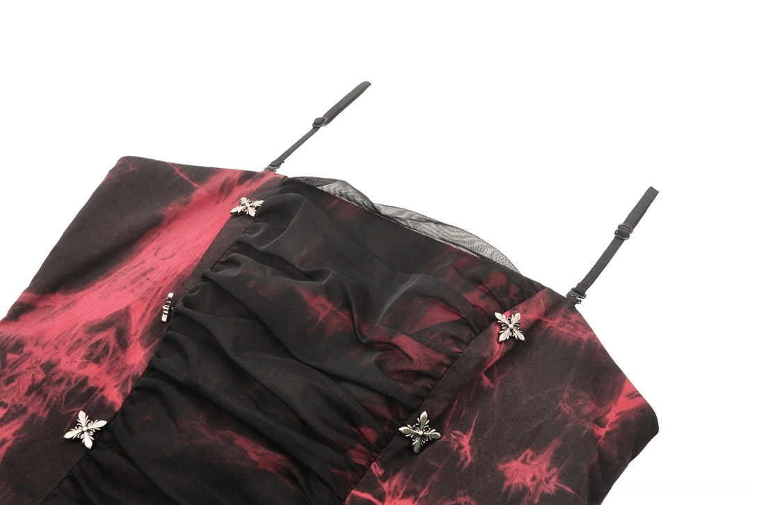 Close-up detail of red and black corset neckline, showing ruched fabric, star fasteners, and delicate spaghetti straps