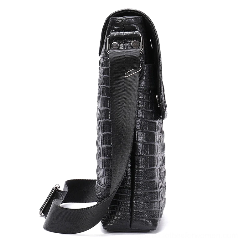 Gothic leather crossbody bag side profile view displaying adjustable fabric shoulder strap