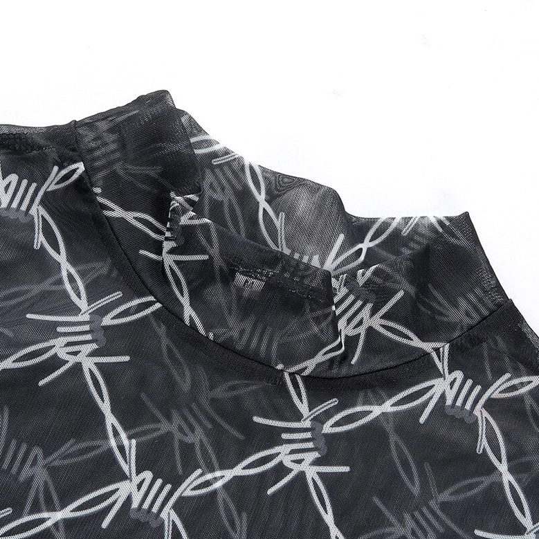 Close-up detail of black mesh crop top neckline showing mock neck and barbed wire print texture