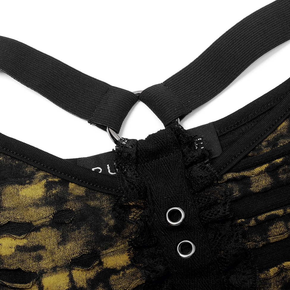 Close-up detail of metal grommets and frayed knit edge on grunge crop top