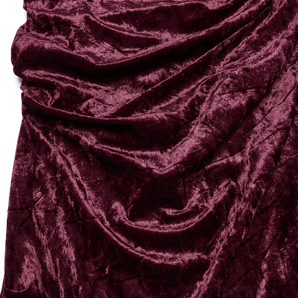 Fabric detail shot of burgundy crushed velvet with soft ruched folds and glossy finish showing luxury texture