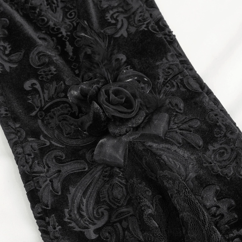 Close-up damask jacquard texture and rose feather decoration details on black lace gothic flared pants