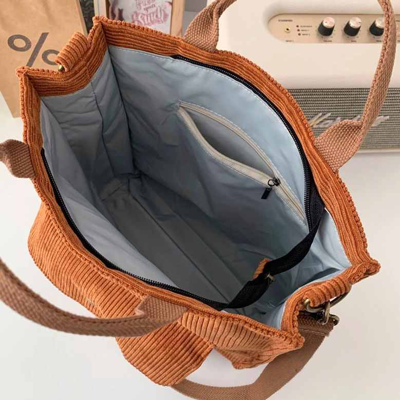 Gothic corduroy tote bag styled with dark academia aesthetic, paired with vintage accessories and alternative fashion pieces