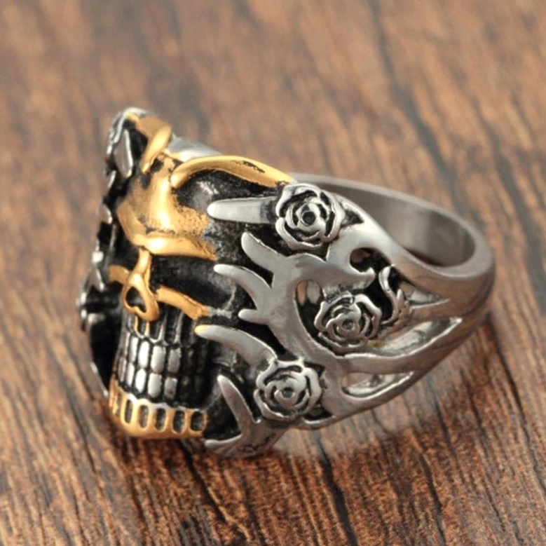 Punk skull rose ring front view on wooden background displaying dual-tone carved details and statement presence
