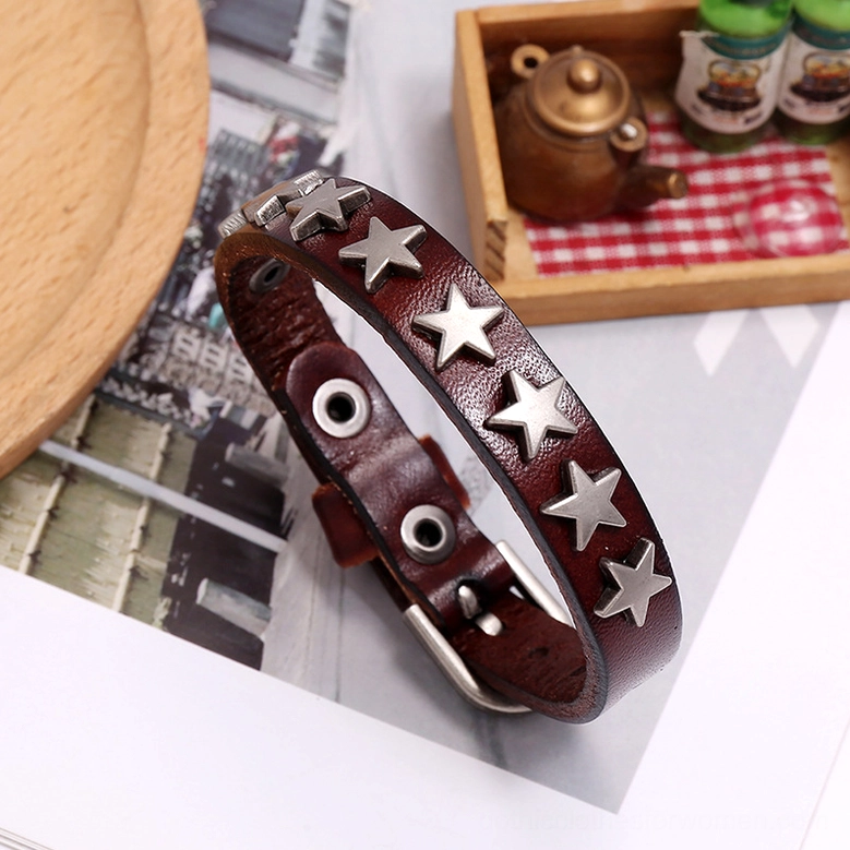 Dark brown gothic star leather bracelet side view displaying vintage leather texture with antique silver stars