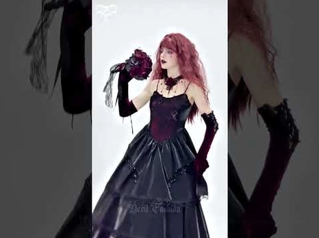 Dark gothic formal gown detail view with velvet gloves and dark rose bouquet elegant corset bodice