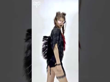 Runway showcase of demon skull gothic backpack styled with punk dark outfit, demonstrating streetwear and alternative fashion coordination