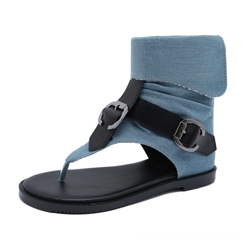 Denim blue gothic gladiator flip flops front three-quarter view with buckle straps, folded denim ankle collar, and open thong toe