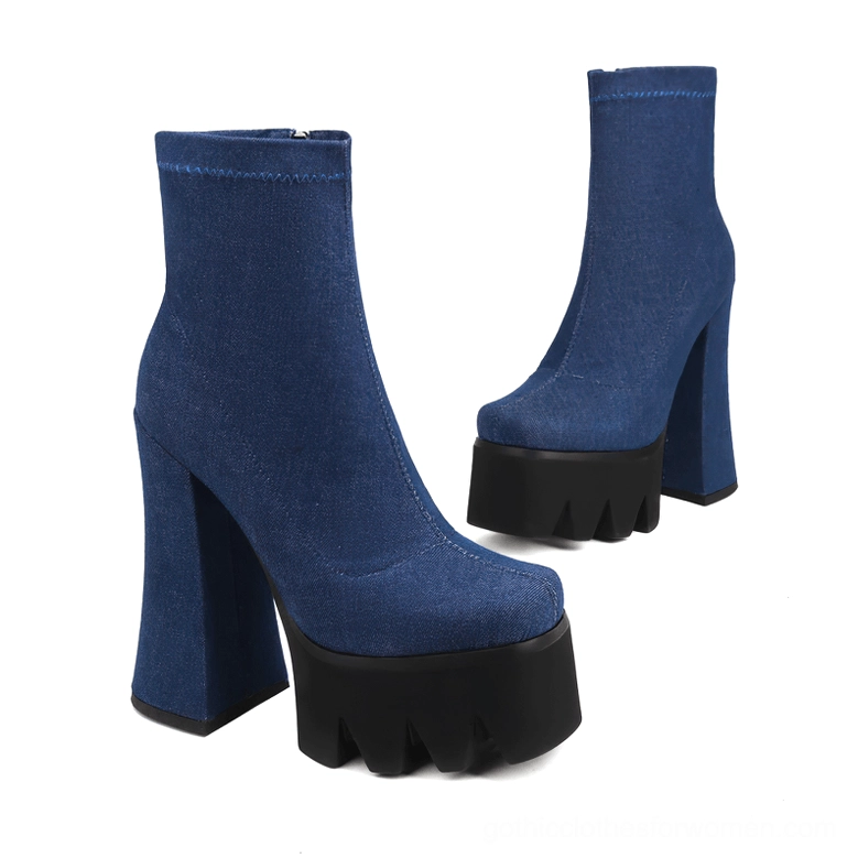 Blue denim gothic platform ankle boots pair shown from angled side view with flared block heels