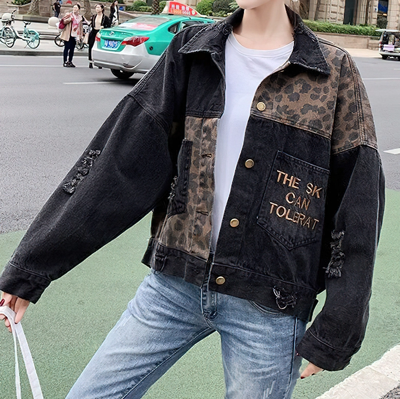 Women's denim jacket styled with white tee and blue jeans, showing side front view and street wear aesthetic