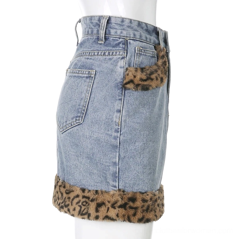 Denim mini skirt left back view, blue denim with brown leopard fuzzy hem trim