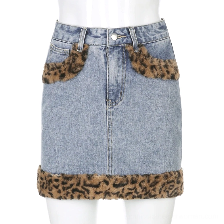 Denim skirt flat lay showing leopard fuzzy hem and pocket decoration details
