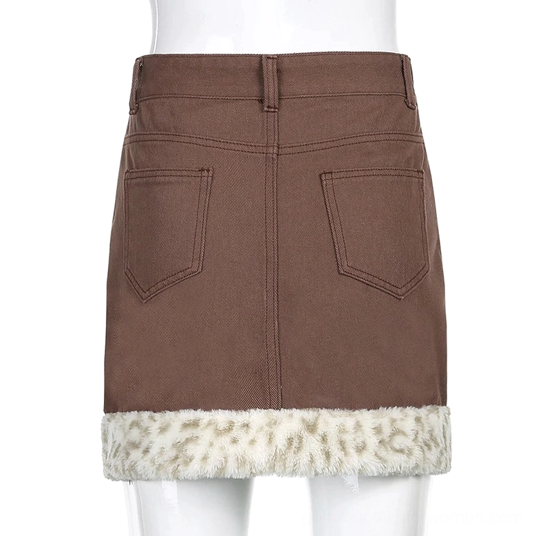 Denim mini skirt detail view showing leopard print fuzzy decoration placement