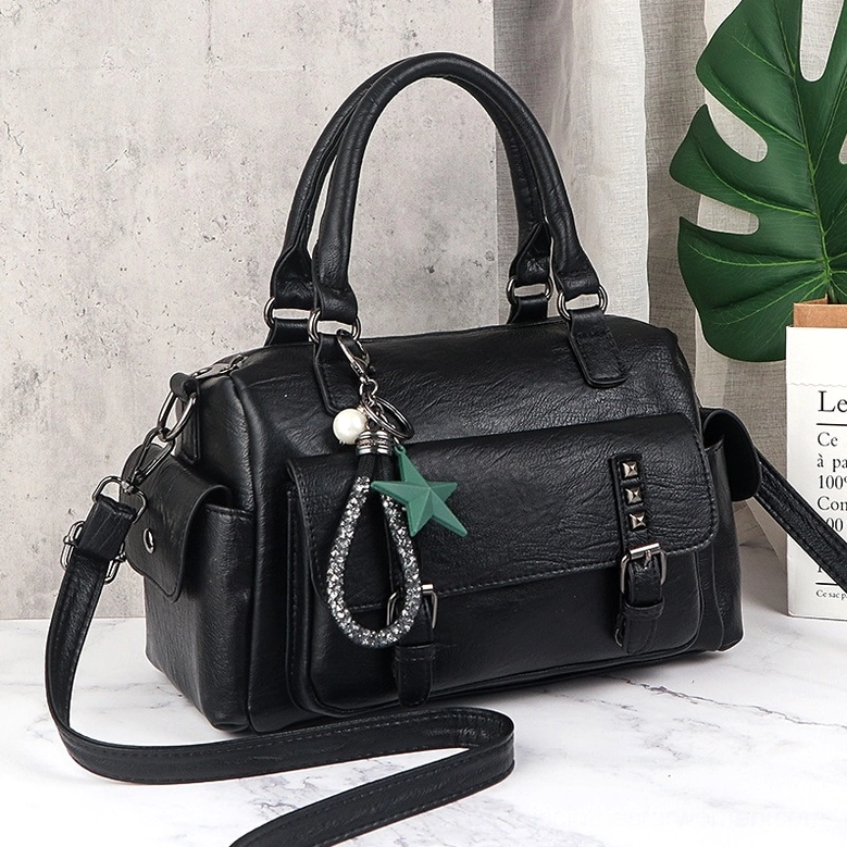 Detachable star pendant charm on gothic leather handbag - occult symbol and spiritual talisman accessory