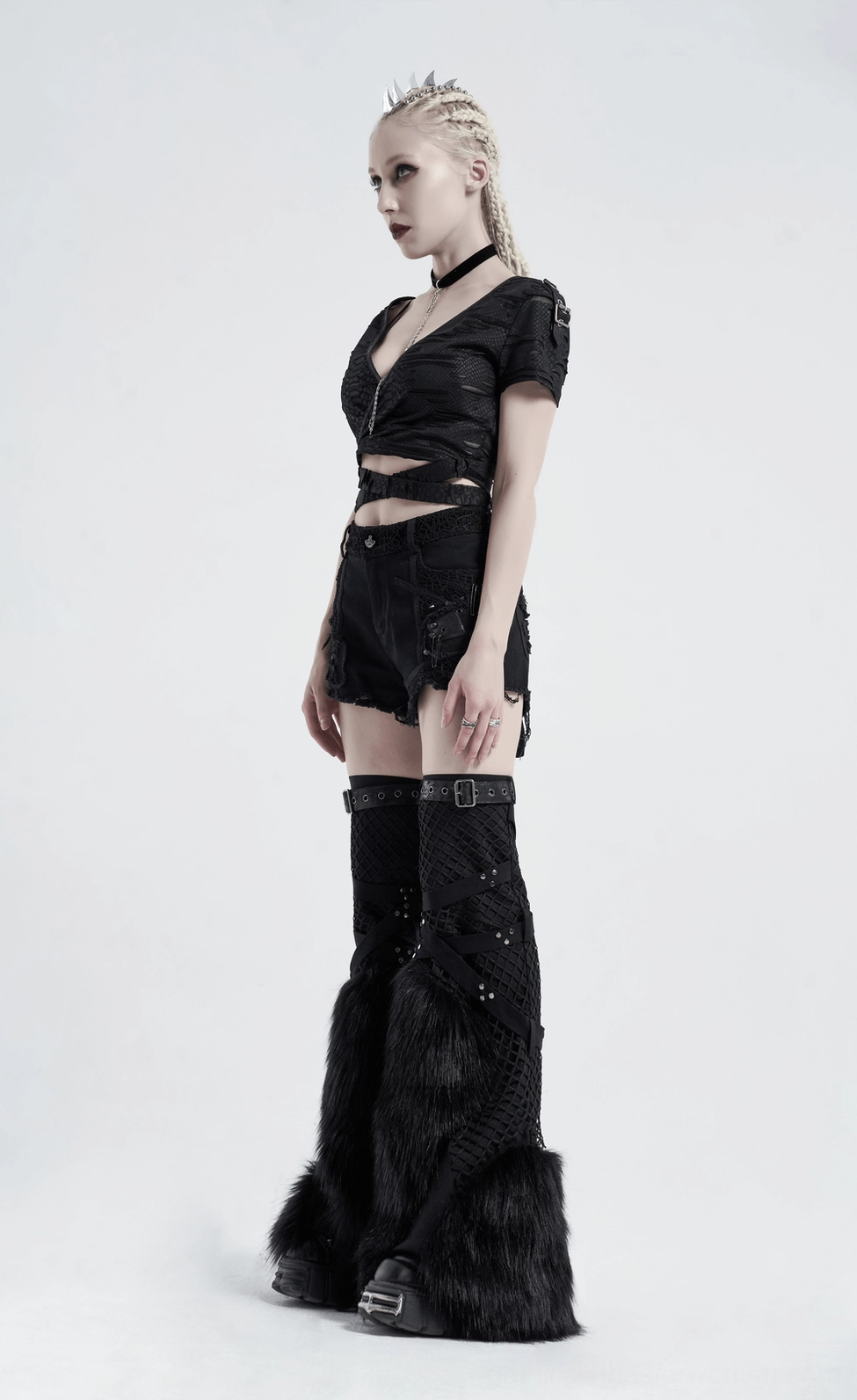 Alternative angle of distressed v-neck gothic crop top on model showing side silhouette and mesh panels