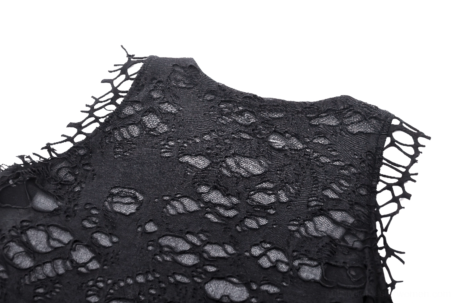 Close-up detail of leather buckle shoulder straps and frayed neckline