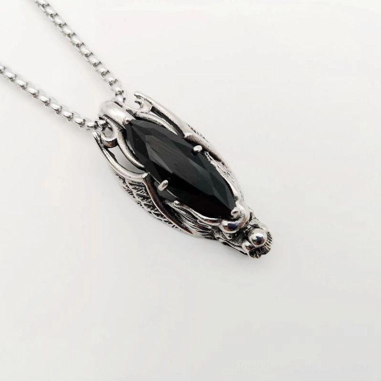 Dragon head gothic pendant necklace in stainless steel with black stone, side top view showing metal texture