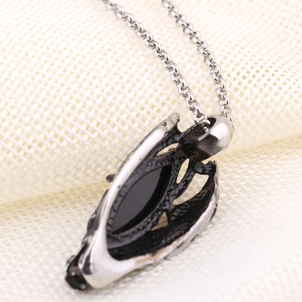 Dragon head gothic pendant necklace showing link chain design and metal frame construction detail