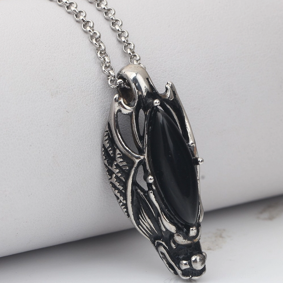 Dragon head gothic pendant necklace, three-quarter side view showcasing stainless steel textured metalwork