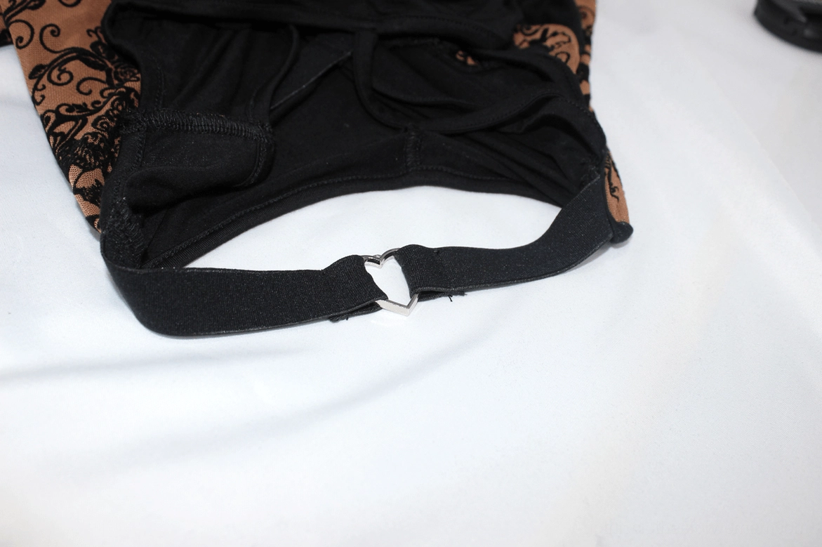 Black webbing strap with D-ring fastener on gothic dress - adjustable elastic shoulder detail