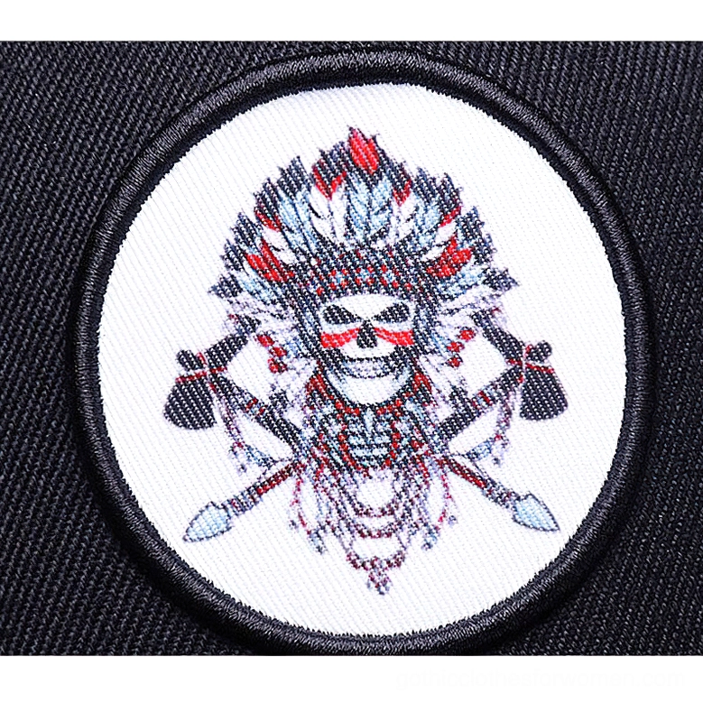 Embroidered round skull badge detailed close-up - gothic cap patch high-resolution view