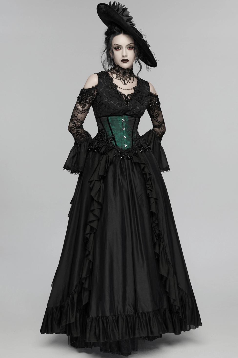 Back view flat lay display of emerald gothic underbust corset showing black lace-up closure system and beaded tassel details