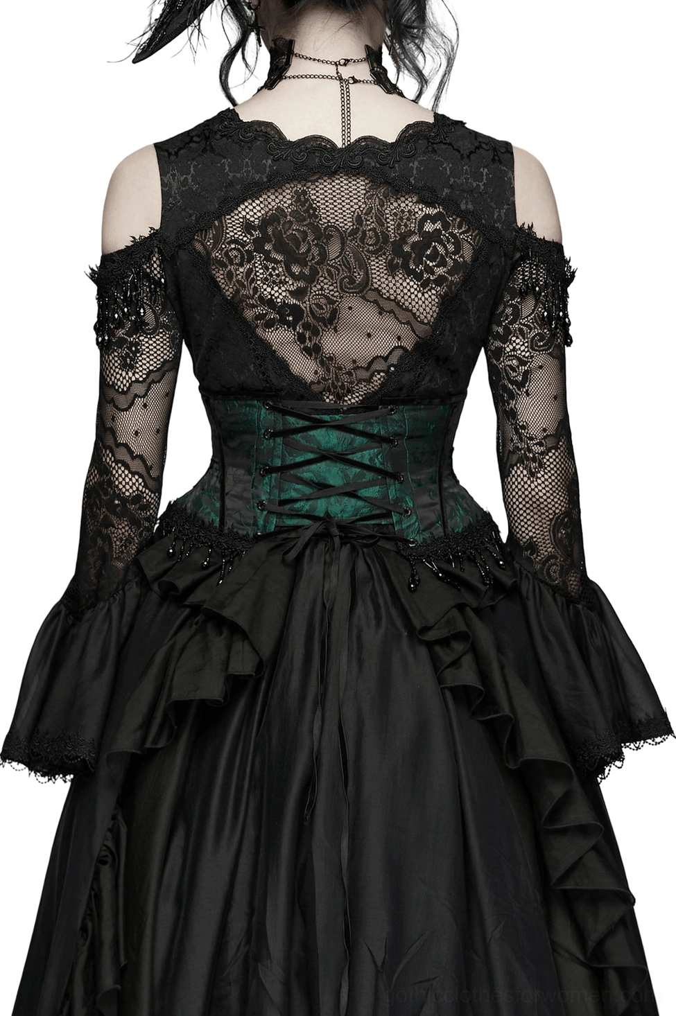 Black lace-up back view of emerald jacquard gothic corset with ruffled black skirt, rear three-quarter perspective showing beaded tassel hem detail