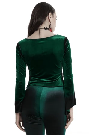 Emerald velvet gothic long sleeve top back view on model, displaying asymmetric ruffled hem and sleeve details