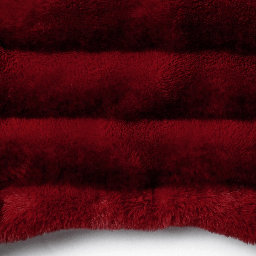 fabric close-up showing horizontal burgundy and black striped faux fur material of gothic jacket