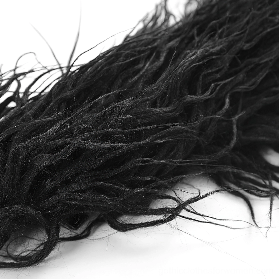 Close-up detail of black faux fur textile showing wavy frayed fibers and quality of faux hair material