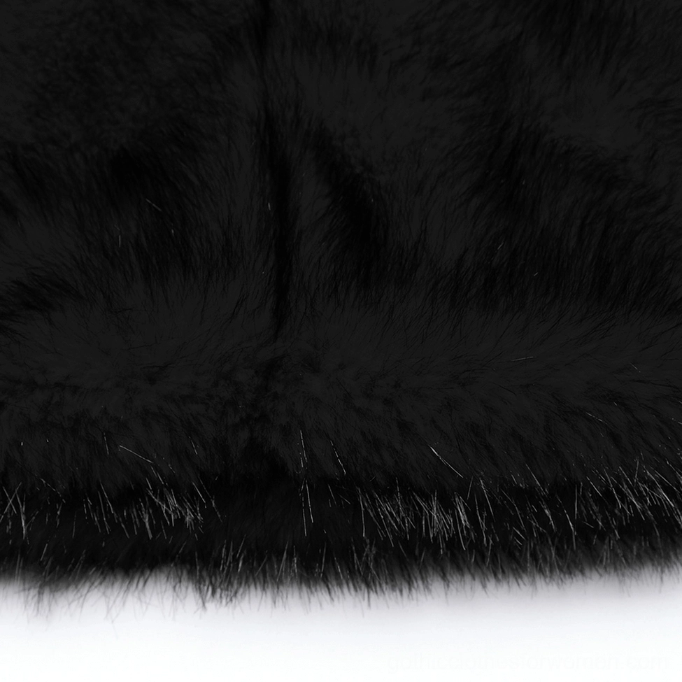 Macro close-up of black faux fur leg warmer fabric showing luxurious long fluffy fur pile with precise trimmed bottom edge and texture depth