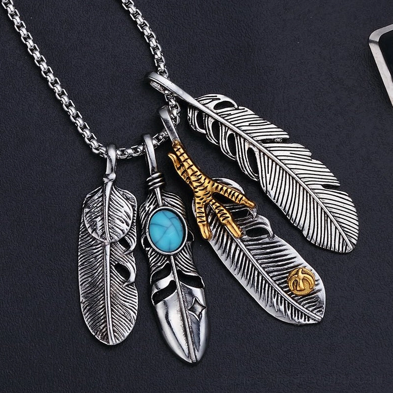 Feather gothic pendant necklace front angle - mixed feather charms with gold claw and turquoise gothic jewelry