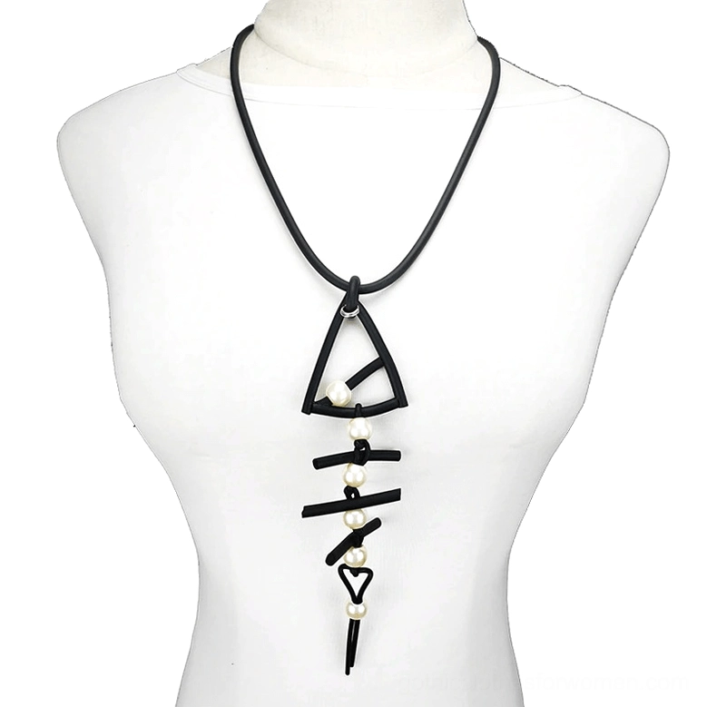 Black fish bone pendant necklace worn on mannequin, showcasing gothic style with pearl accents and heart clasp detail