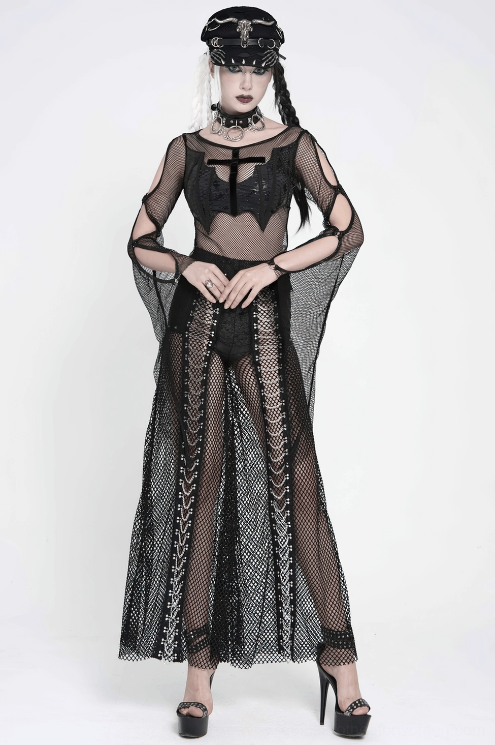 Black fishnet trousers hem and leg opening close-up showing flare width and fabric drape