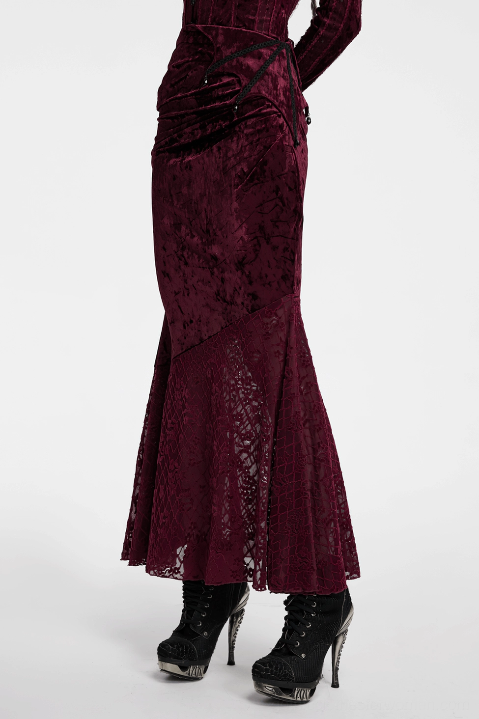 Wine red gothic velvet fishtail skirt hem detail displaying ornate lace pattern and structural fishtail cut design
